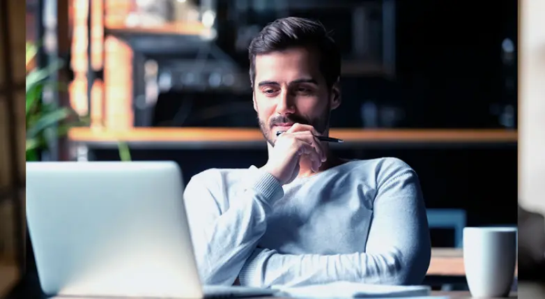 White startup owner sitting thinking about the difficulties of entering the technological market