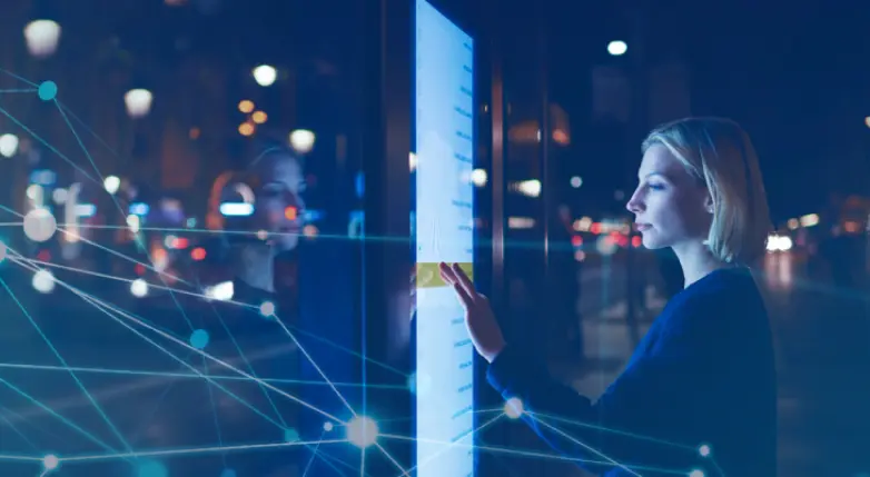 White blonde woman working on a touchscreen